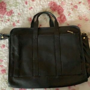 Black leather briefcase/laptop bag. Very durable.